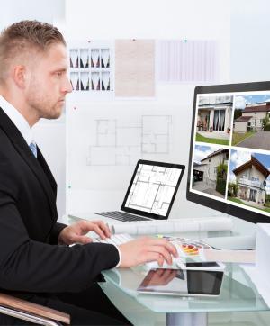 estate agent looking at property portfolio online